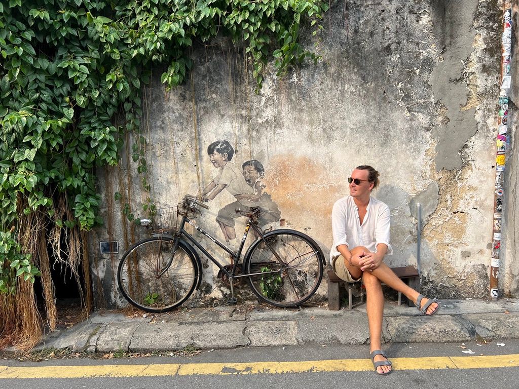 Sister and boy on a bicycle, mural wall painting in Georgetown, Penang, Malaysia 