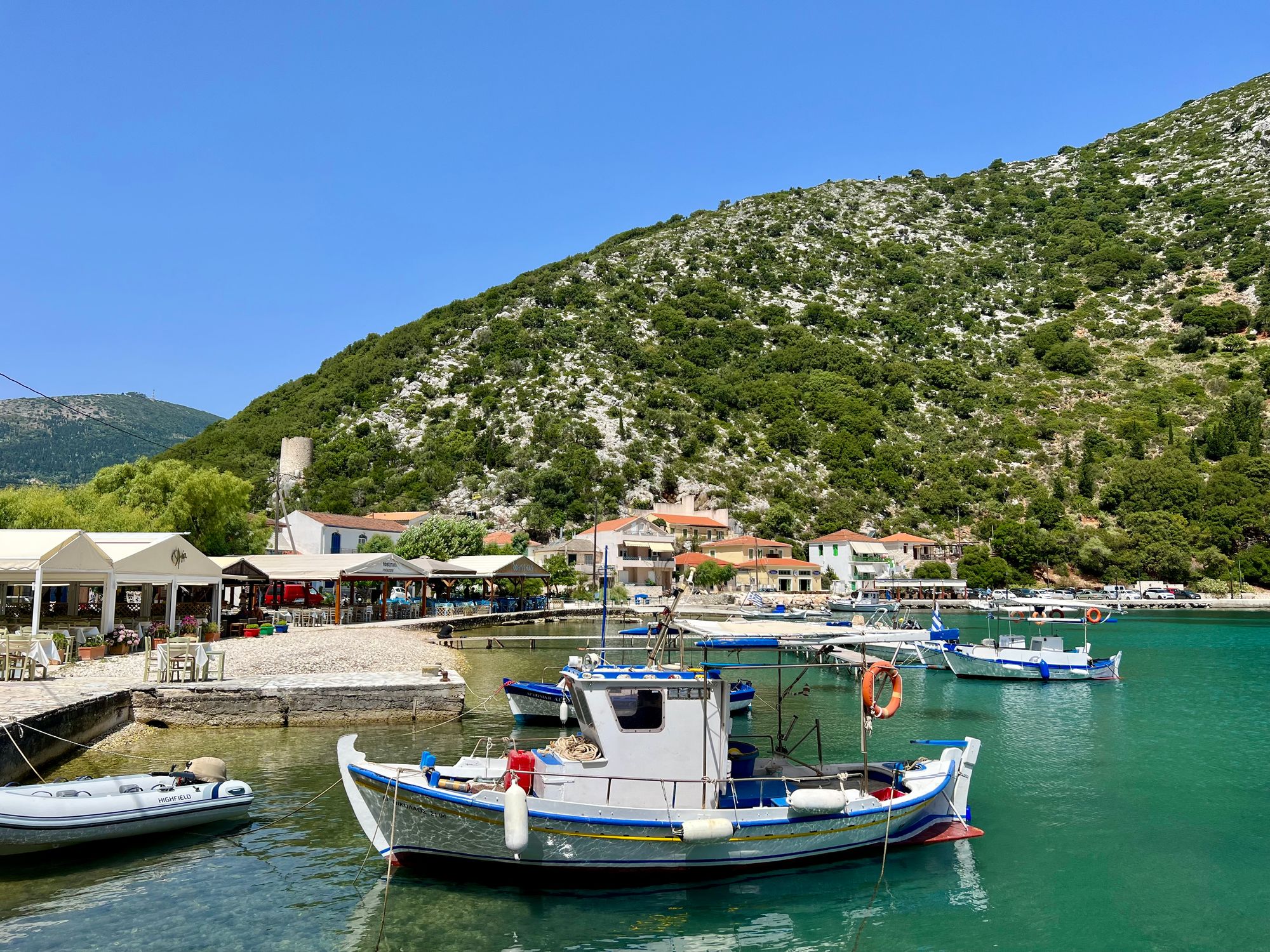 Small town, restaurants, houses, Fishermans boat in Frikes, Ithaca, Greece