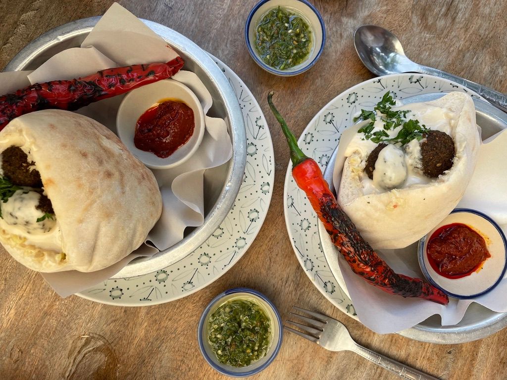 Restaurant Hummus in Chiang Mai, Thailand. Two pitas with falafal and spicy dip.