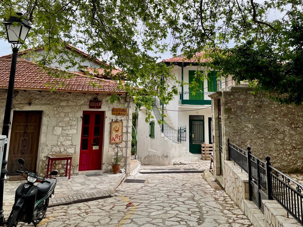 Small houses and cobblestones street, billage Karia, Lefkada, Greece.