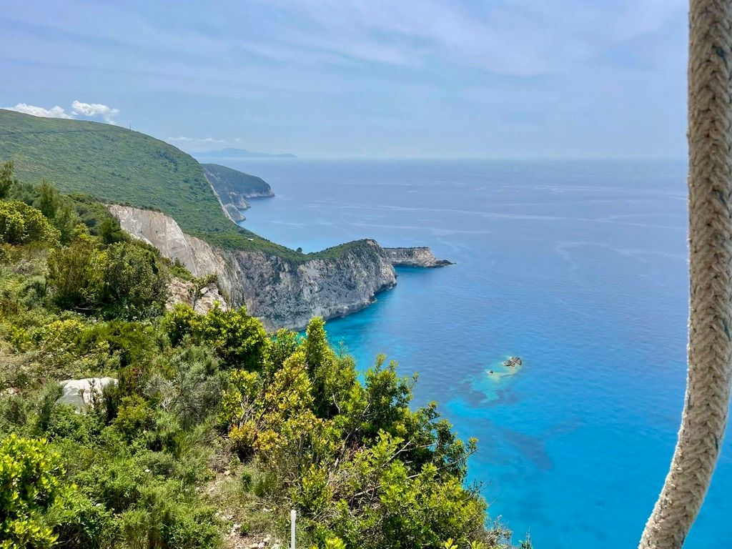 Paragliding view from Kathisma Beach, Lefkada, Greece, Crystalclear water and lush mountains.