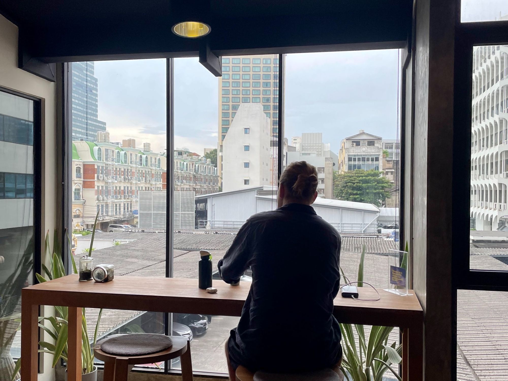 Izaac working from a desk at Wolf Coworking Space, Bangkok, Thailand