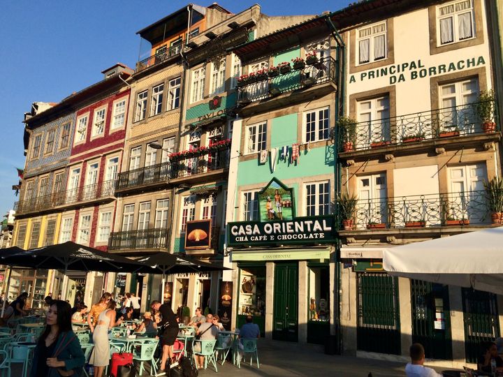 Old houses in Porto, Casa Oriental Cha Cafe and chocolate, people sitting on the terrace, sunny weather